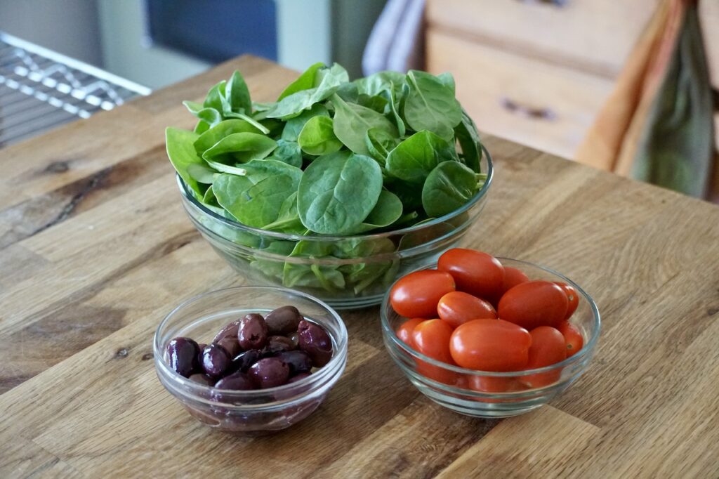 The fresh add-ins include baby spinach, cherry tomatoes and black olives