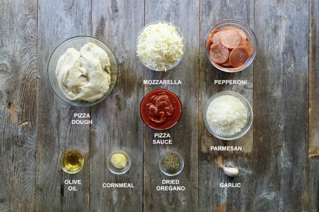 All of the ingredients for easy sheet pan pizza