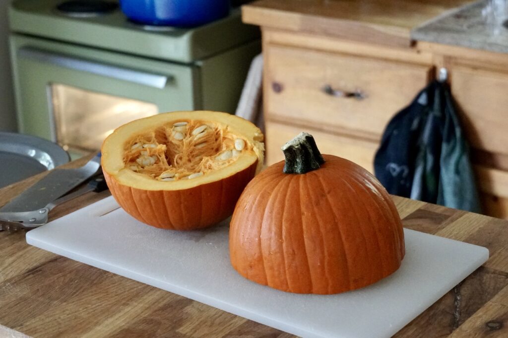 A medium-sized sugar pumpkin cut in half