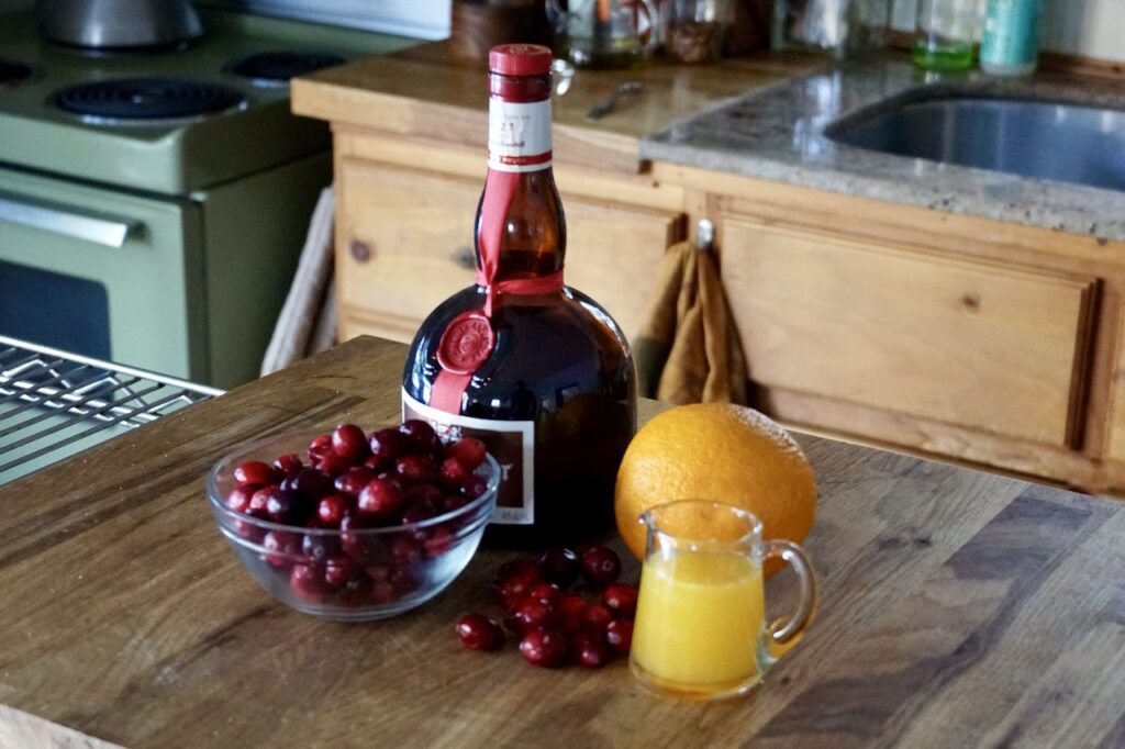 Grand Marnier, orange juice, fresh cranberries and a navel orange.