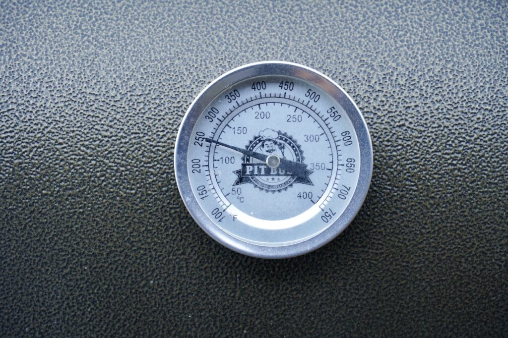 The thermometer showing the cooking temperature of 250°F / 121°C