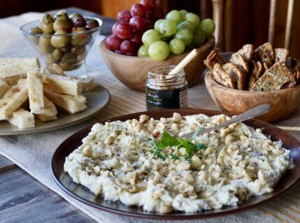 Whipped Ricotta with Truffle Honey served with warmed bread, crackers, fresh fruit and seasoned olives.