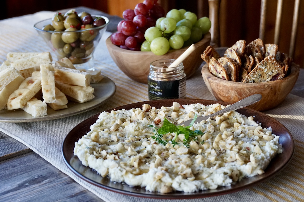 Whipped Ricotta with Truffle Honey served with warmed bread, crackers, fresh fruit and seasoned olives.