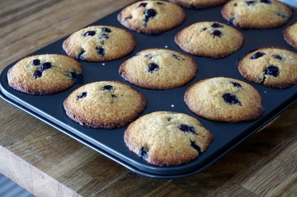 Freshly baked Blueberry Corn Muffins right out of the oven.
