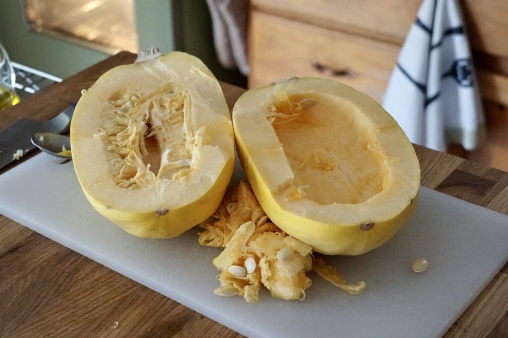 A 3-pound spaghetti squash cut in half lengthwise with the seeds scooped out.