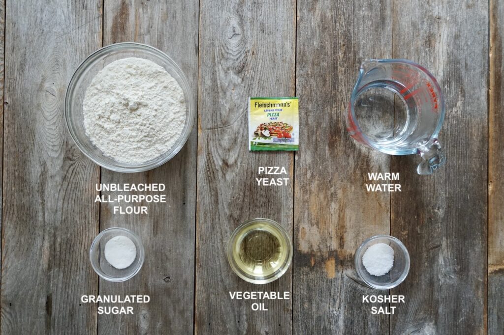 Make-your-own pizza dough with unbleached all-purpose flour, pizza yeast, sugar, salt, vegetable oil and warm water.