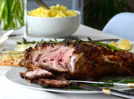 A roasted leg of lamb served with grilled asparagus and mashed potatoes for our 25 essential easter recipes.