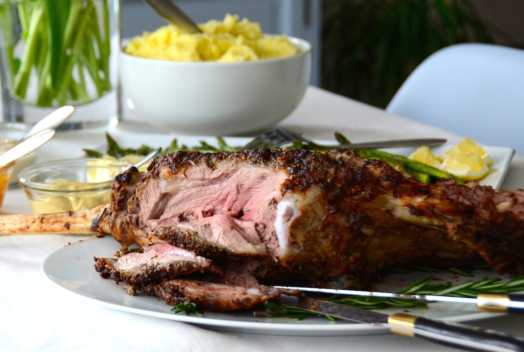 A roasted leg of lamb served with grilled asparagus and mashed potatoes for our 25 essential easter recipes.