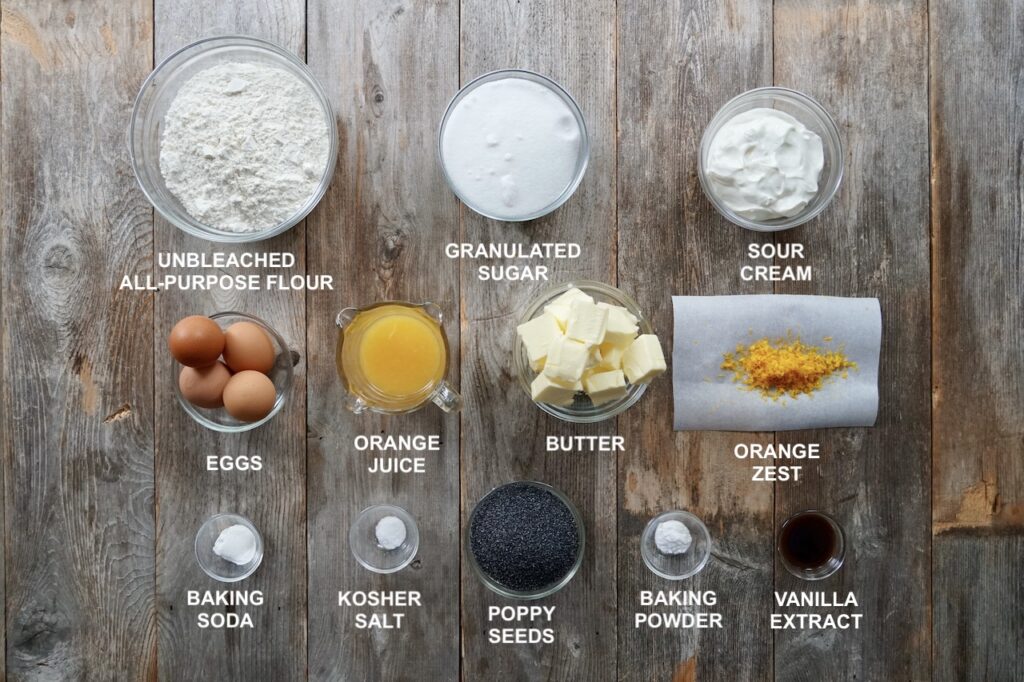 A photo of all the ingredients needed to make an Orange Poppy Seed Cake.