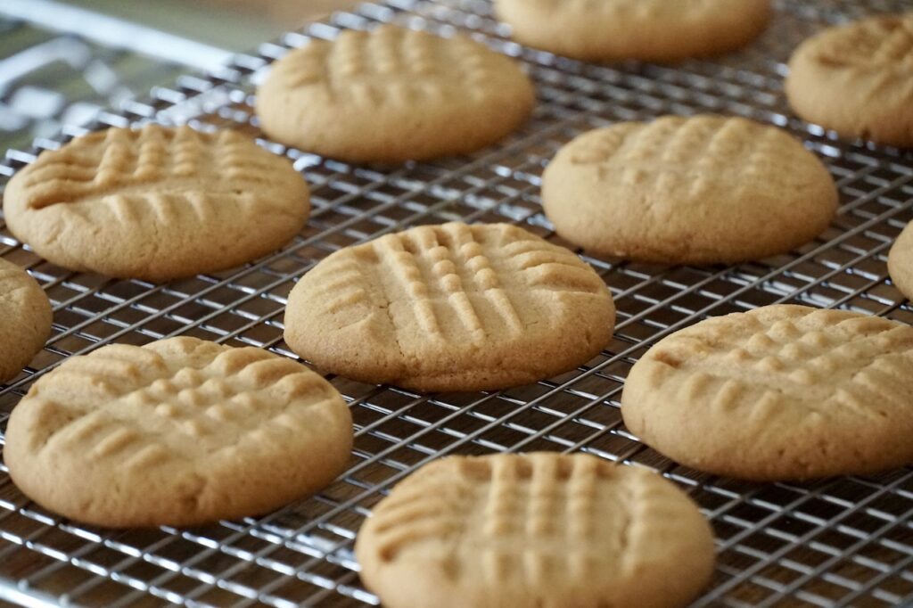 Old fashioned peanut butter cookies with the traditional criss cross pattern on the top of each cookie.