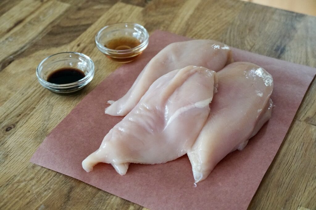 Skinless boneless chicken breasts with sesame oil and soy sauce.