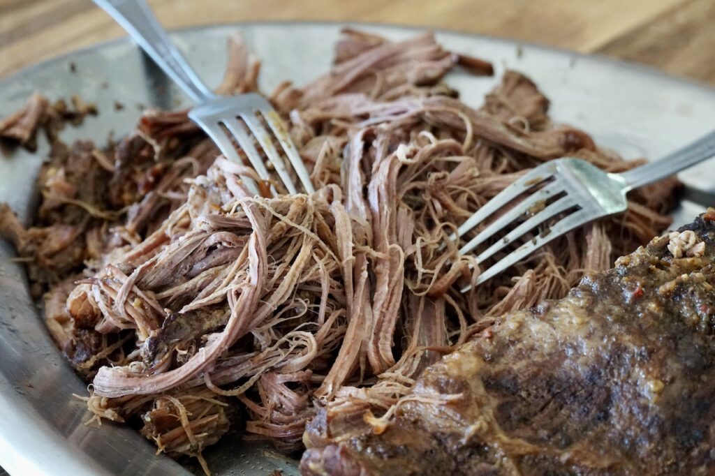 The brisket pulled apart using two forks.