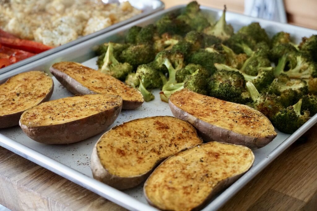 A tray of the oven-roasted sweet potatoes and broccoli.