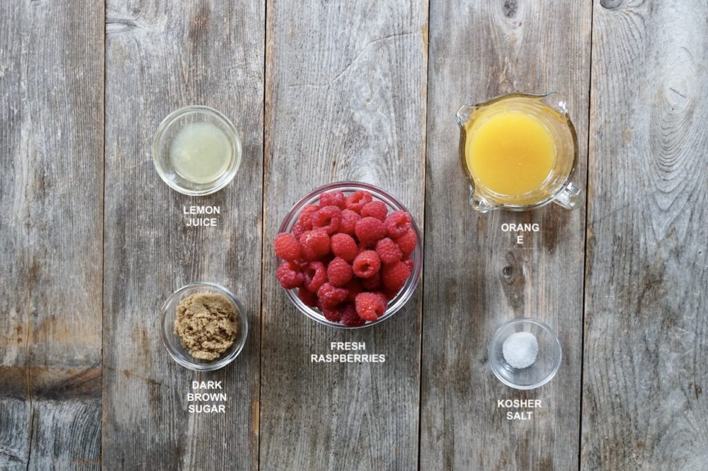 The ingredients needed to make a fresh berry syrup.