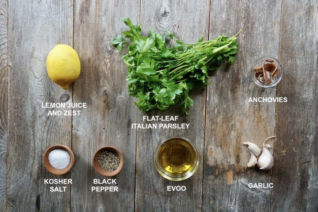 Ingredients for the gremolata include; lemon, parsley, anchovies, garlic, olive oil and seasoning.