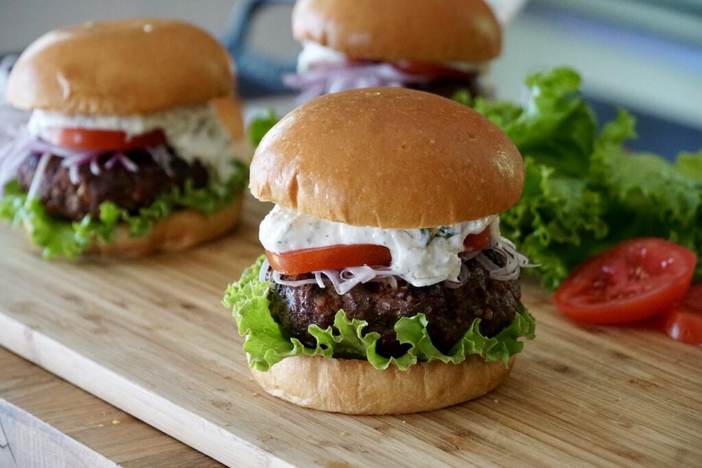 Grilled Kofta Burgers served with a dollop of Feta Cheese Dip.