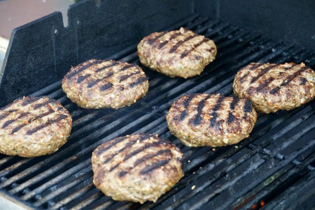 The kofta burgers on the grill.