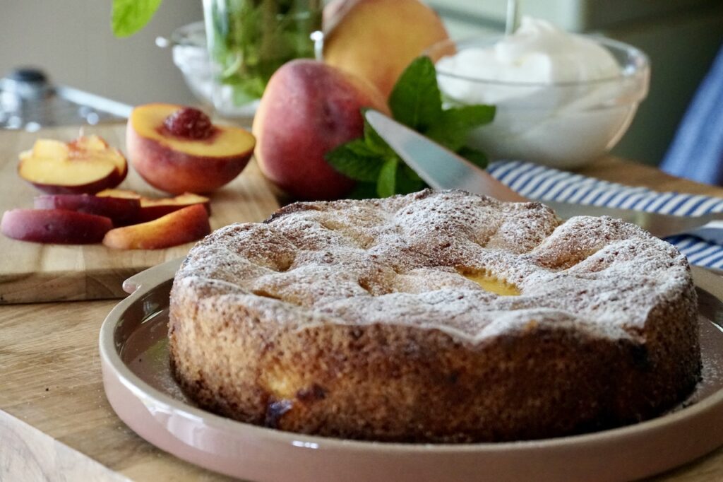 The Peach Cake dusted with icing sugar.