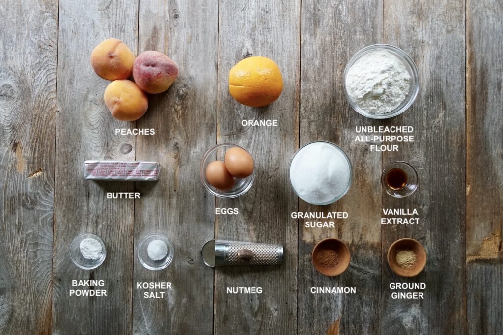 A grouping of the various ingredients needed to make a Fresh Peach Cake.