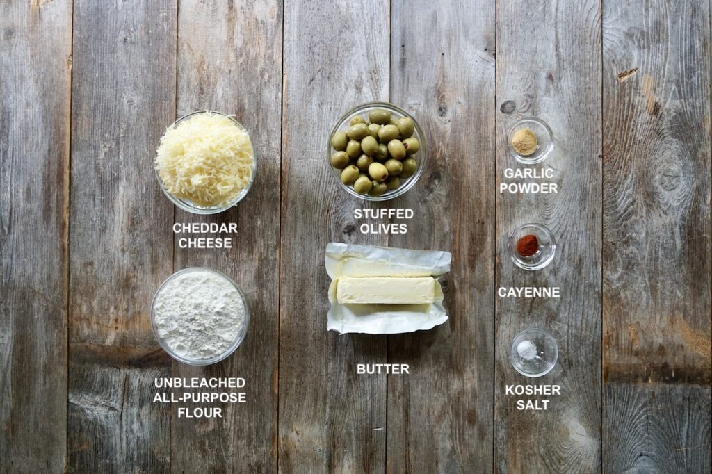 The ingredients needed to make Baked Cheddar Olives.