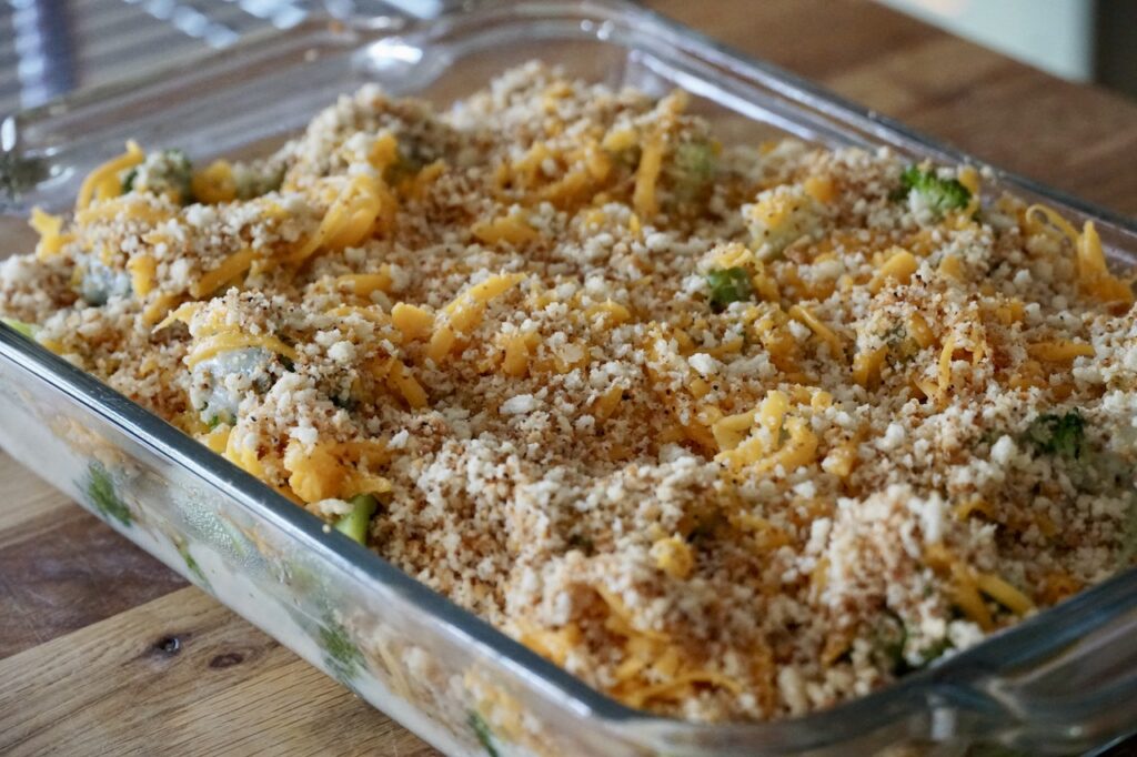 A large rectangular casserole dish containing the Cheesy Broccoli Casserole.