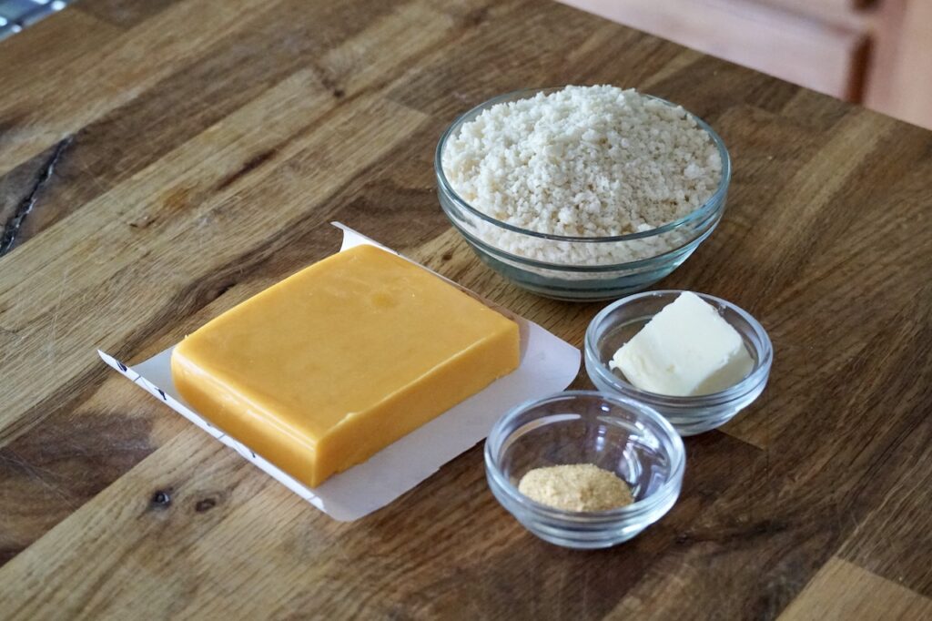 Ingredients for the topping made with aged sharp cheddar cheese, panko breadcrumbs, butter and garlic powder.