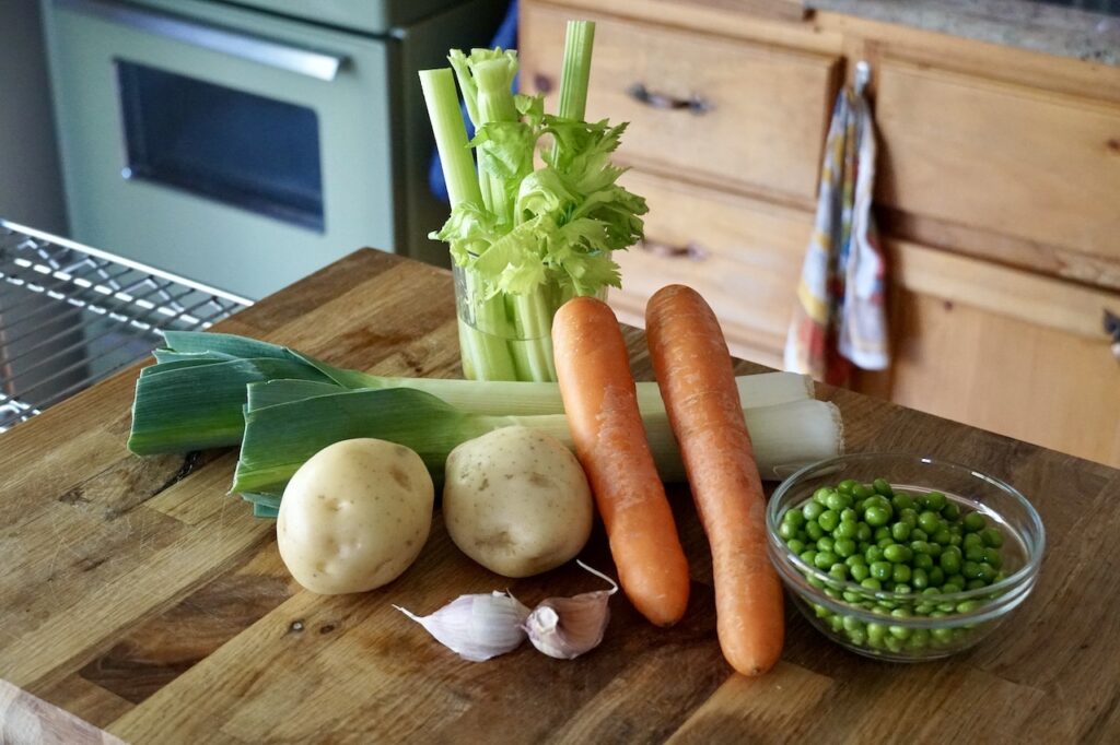 Carrots, leeks, potatoes, garlic, green peas and celery.