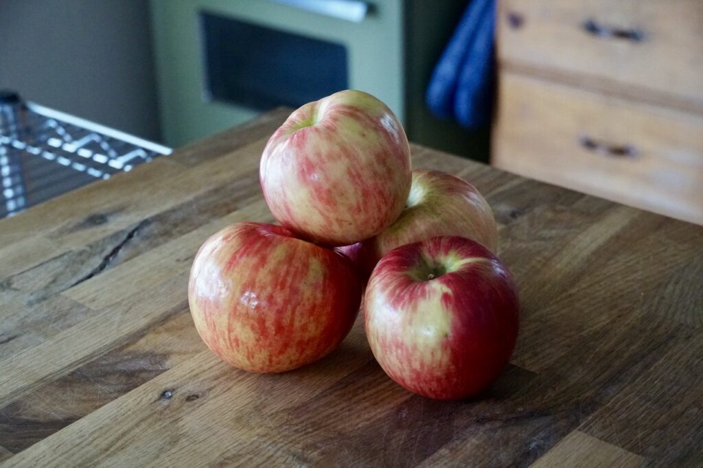 Four Honeycrisp apples.