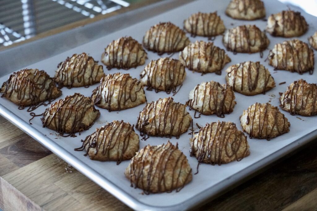 The coconut macaroons with a drizzle of chocolate.