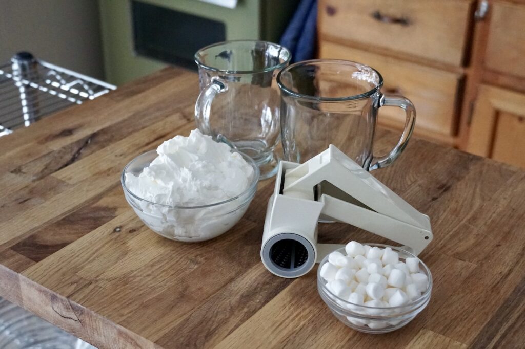 Garnishes for hot chocolate include whipped cream, mini marshmallows and premium milk chocolate.