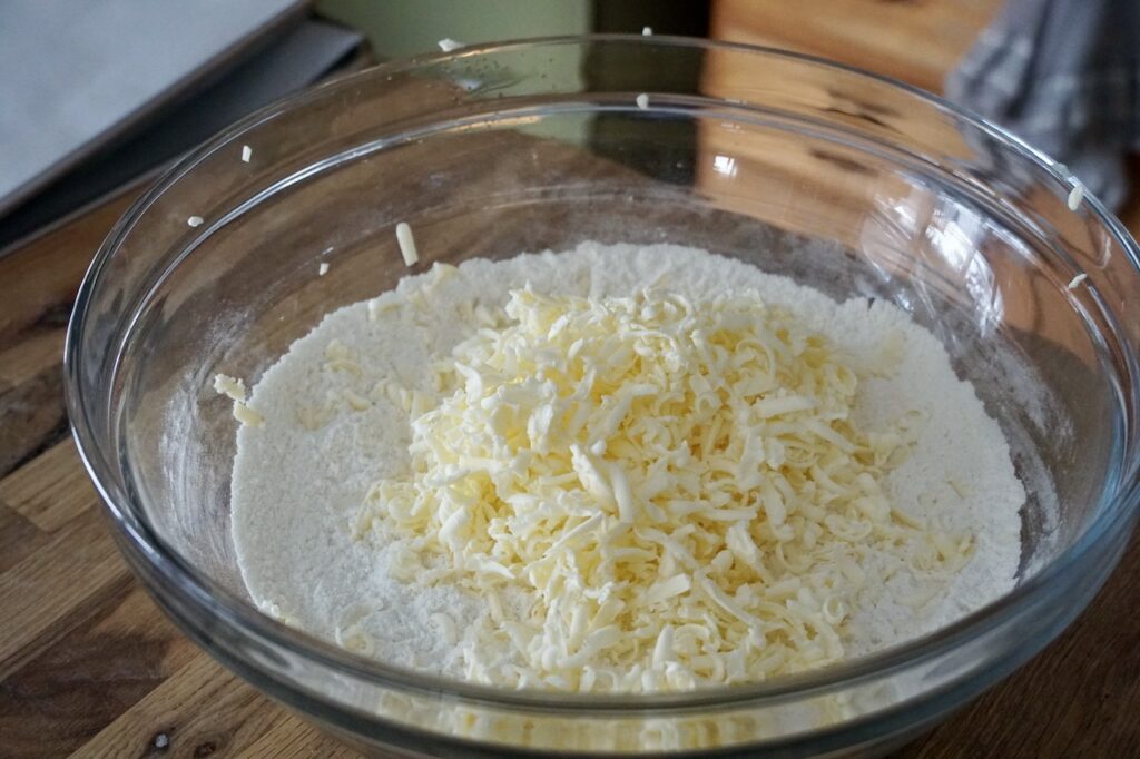The bowl of dry mix with the grated cold butter.