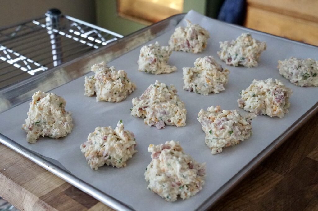 Drop the biscuits onto parchment-lined baking trays.