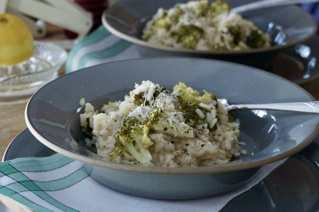 Broccoli Lemon Risotto served in large pasta plates.