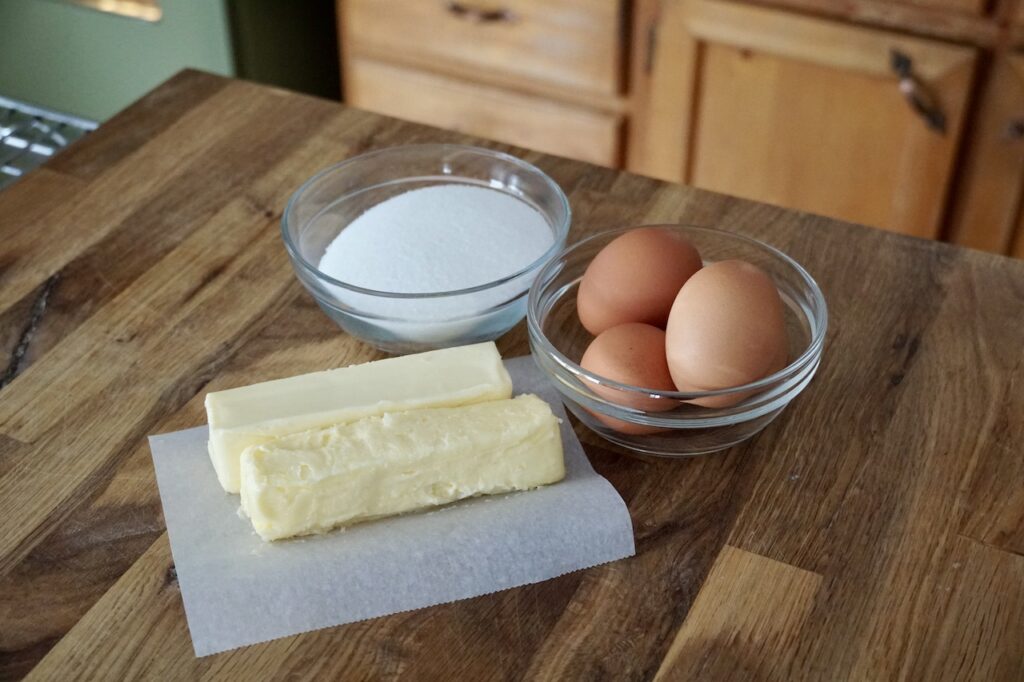 The wet ingredients include granulated sugar, butter and eggs.