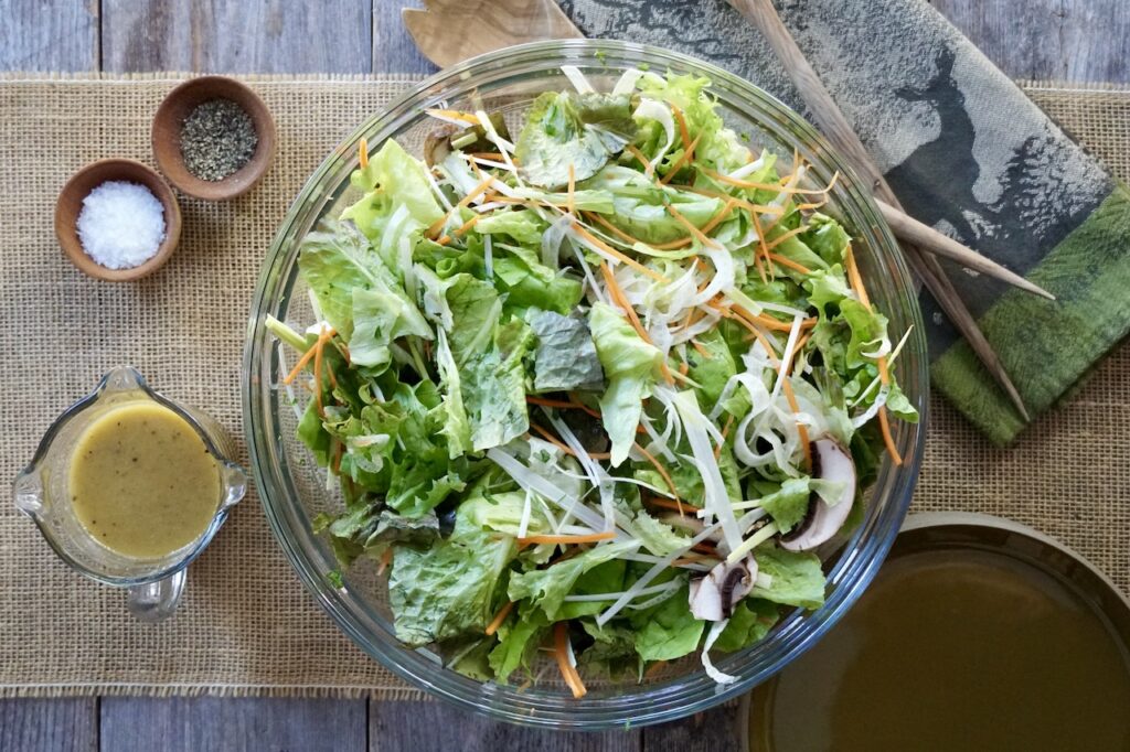 An overhead photo of a large salad bowl containing the Mixed Salad Recipe.