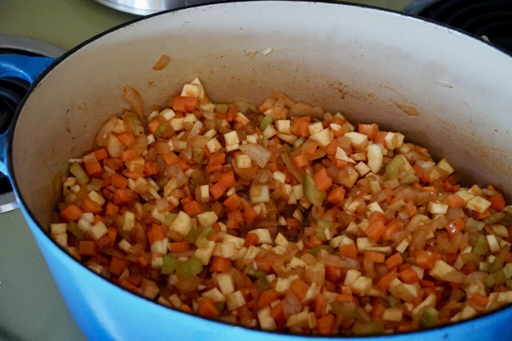 All of the diced veggies sautéed in the large pot.