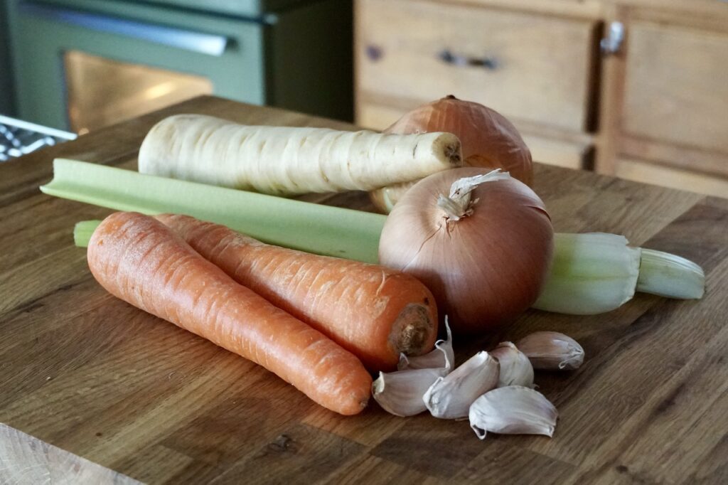 The vegetables used in the mirepoix: carrots, onions, celery, parsnip and garlic.
