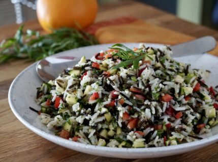 Easy Rice Salad presented in a beautiful presentation diish.