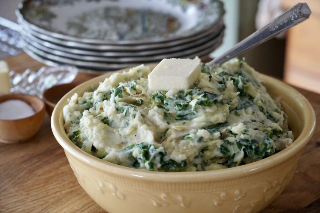 Colcannon Potatoes served with a knob of butter, melted on top.