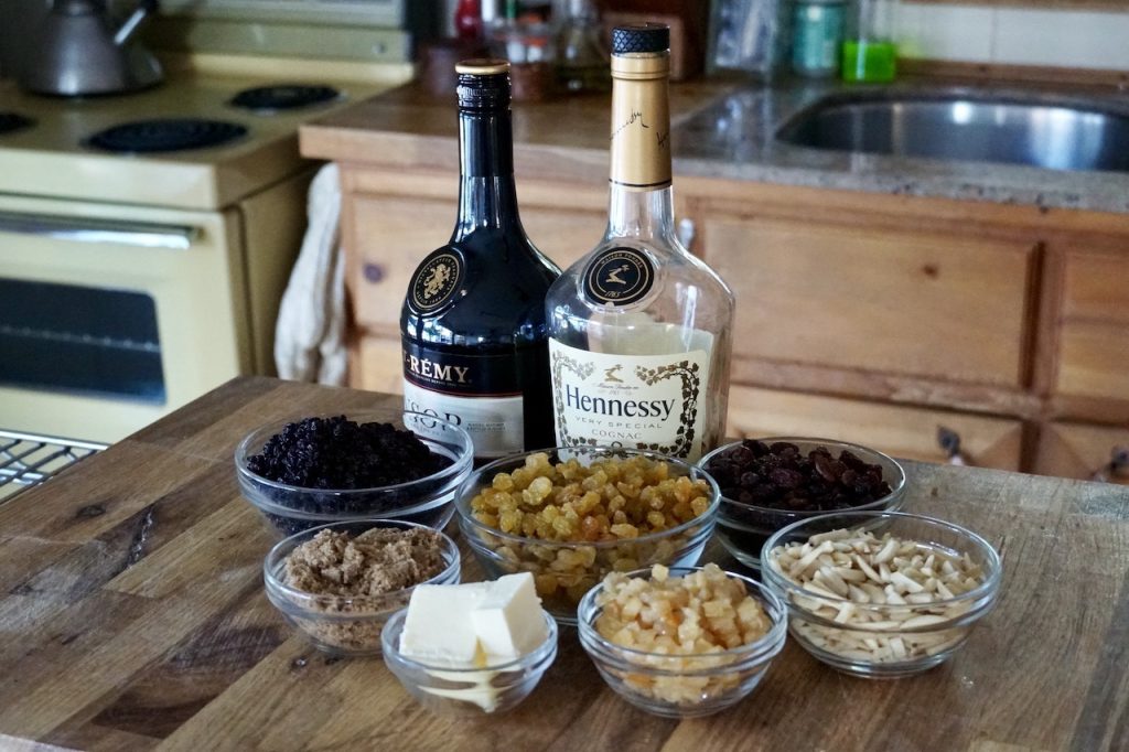 Bowl containing the assorted dried fruits and nuts plus some butter, cognac and brandy.