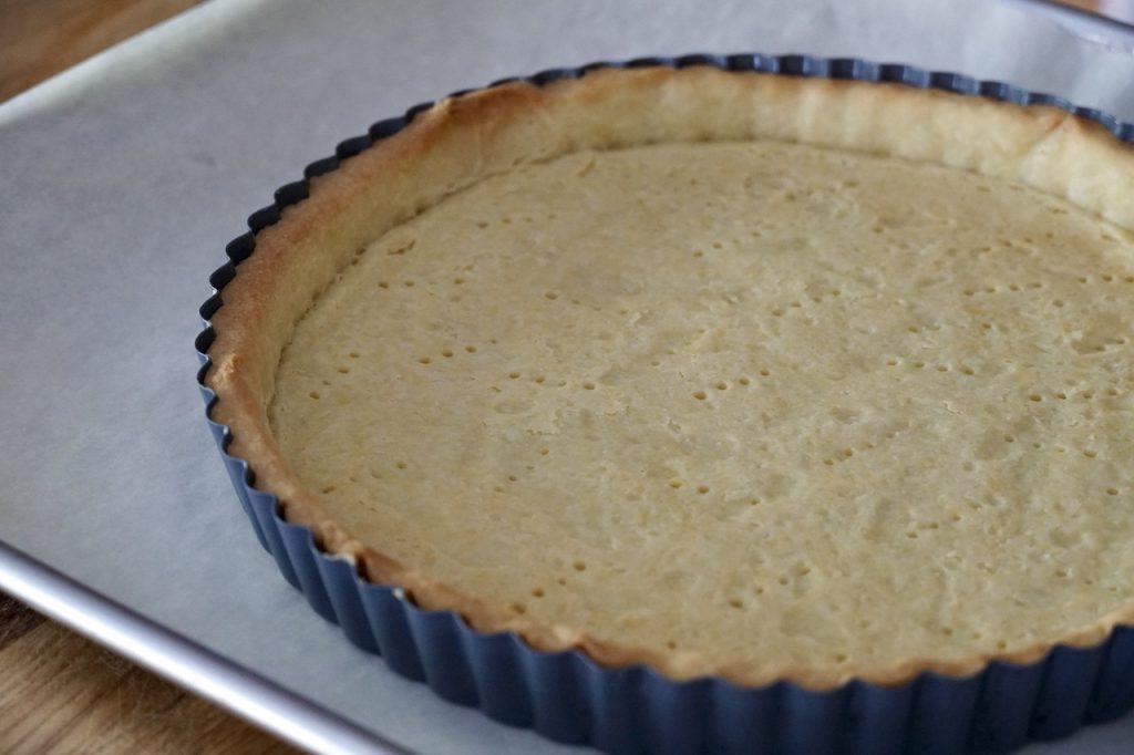 The pastry shell cooling after being blind baked.