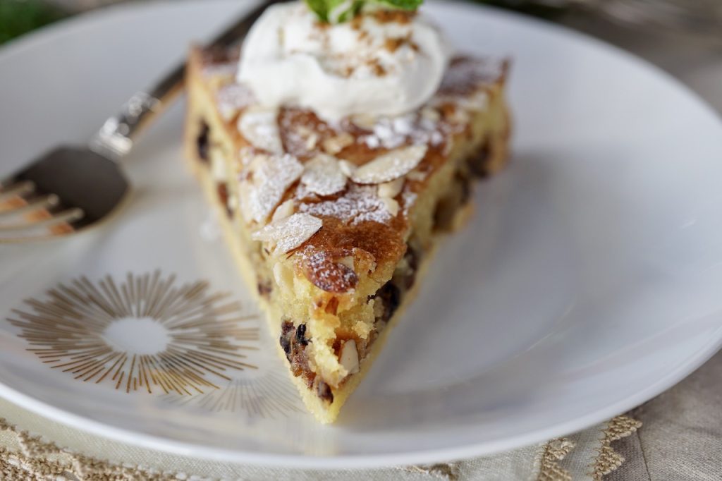 A wedge of mincemeat frangipane tart ready to be enjoyed!