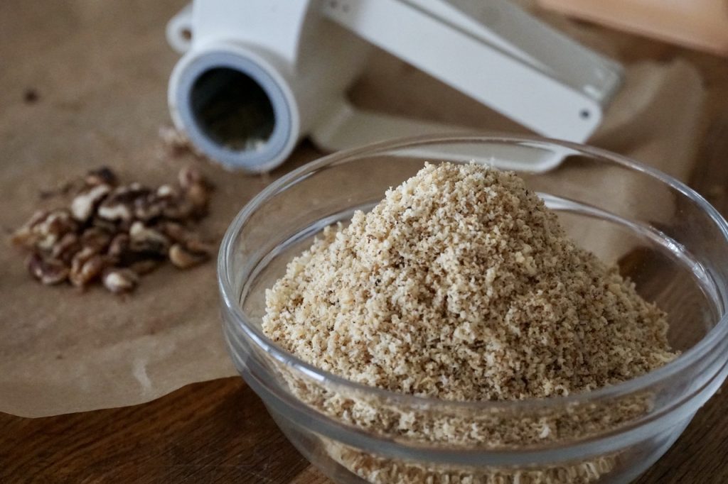 Toasted walnuts ground using a hand grinder.