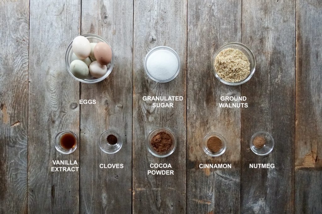 The ingredients for Bûche de Noël include everything for a spice walnut sponge cake: eggs, sugar, ground walnuts. cocoa and spices.