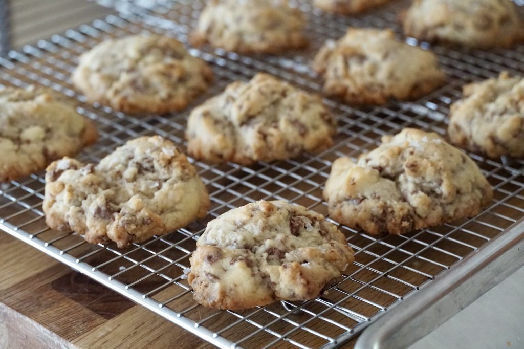 The shortbread cookies cooling on a wire rack.