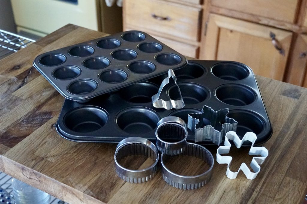 Assorted muffin tins plus a few biscuit cutters and festive holiday cookie cutters.