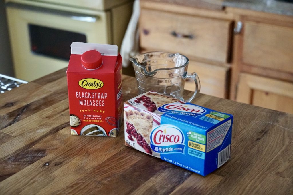 A carton of blackstrap molasses and a box of pure vegetable shortening.