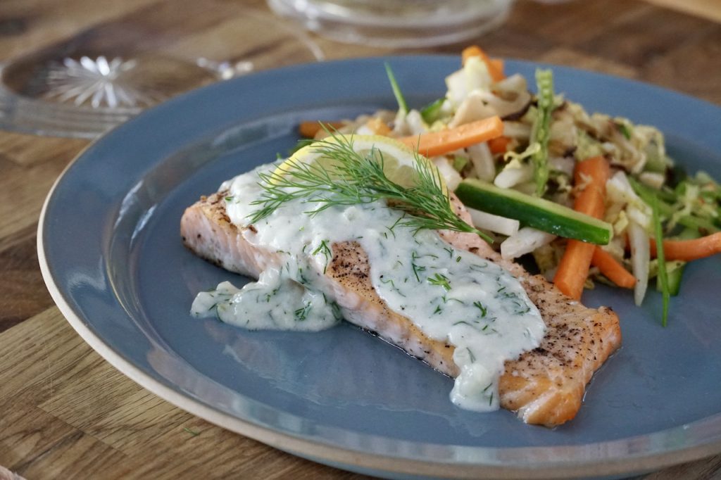 Lemony Dill Sauce spooned over baked salmon.