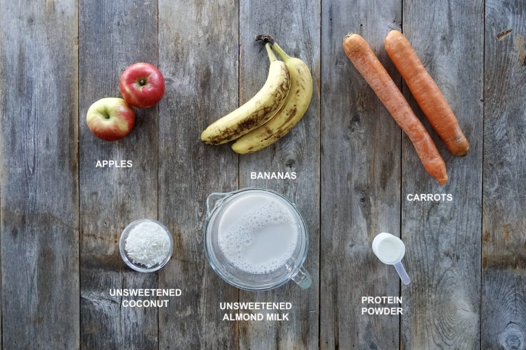 Ingredients for a Healthy Smoothie Recipe include: apples, bananas, carrots, almond milk, coconut and protein powder.
