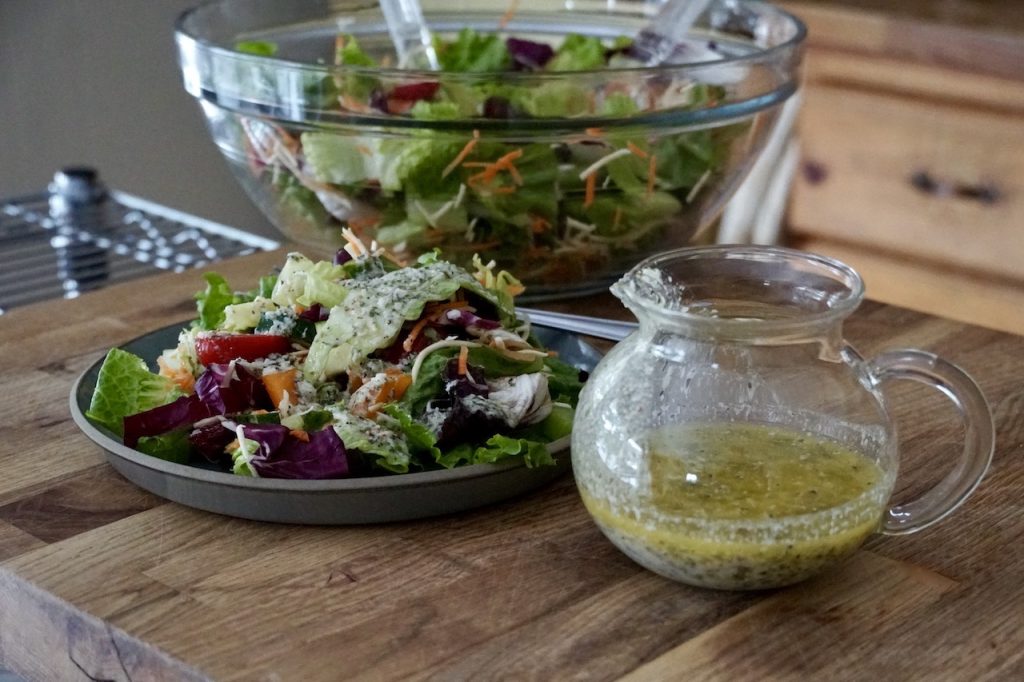 Homemade Italian Dressing Recipe served over a salad of assorted fresh vegetables.